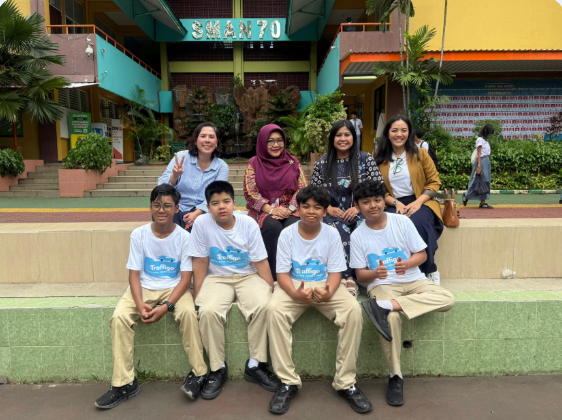 Students in Traffigo shirts with teachers at SMAN 70 Jakarta